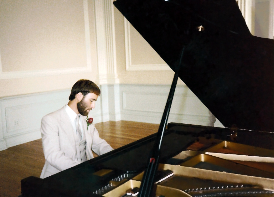 Composer Brian Wilbur Grundstrom playing the piano at Gettysburg College